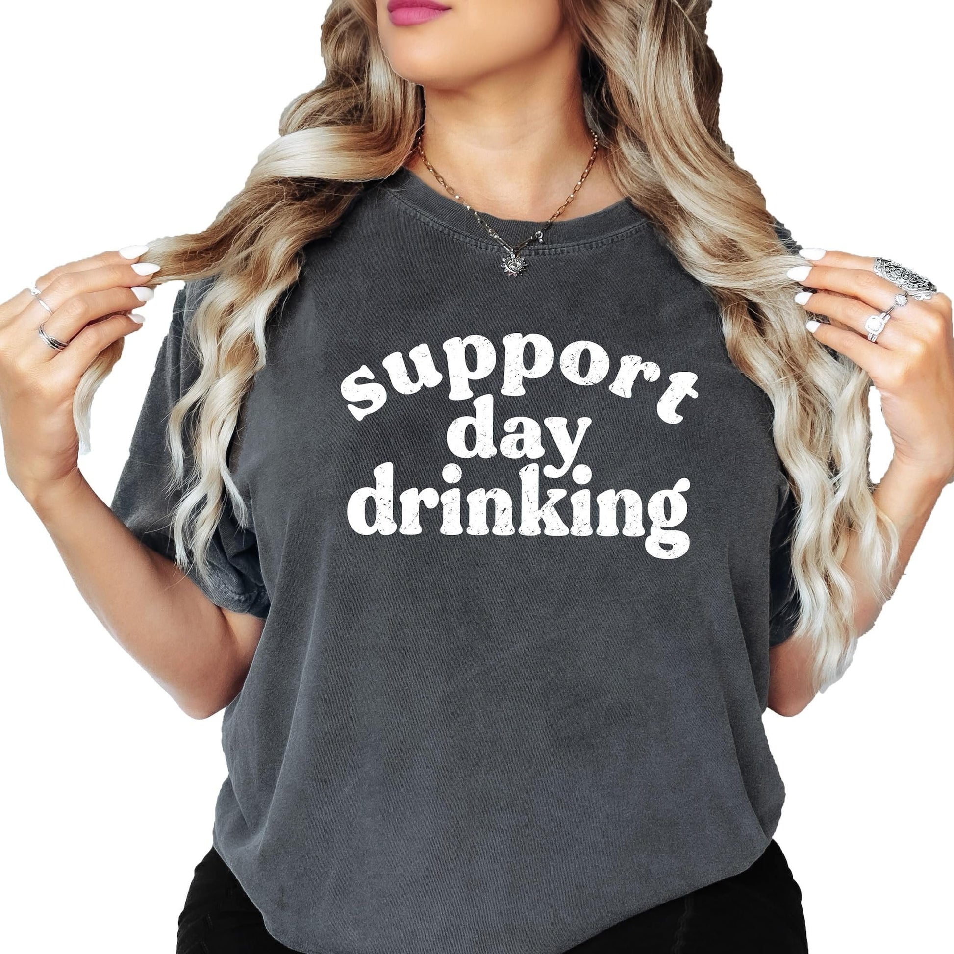 Woman wearing ivory Support Day Drinking graphic tee casual styling