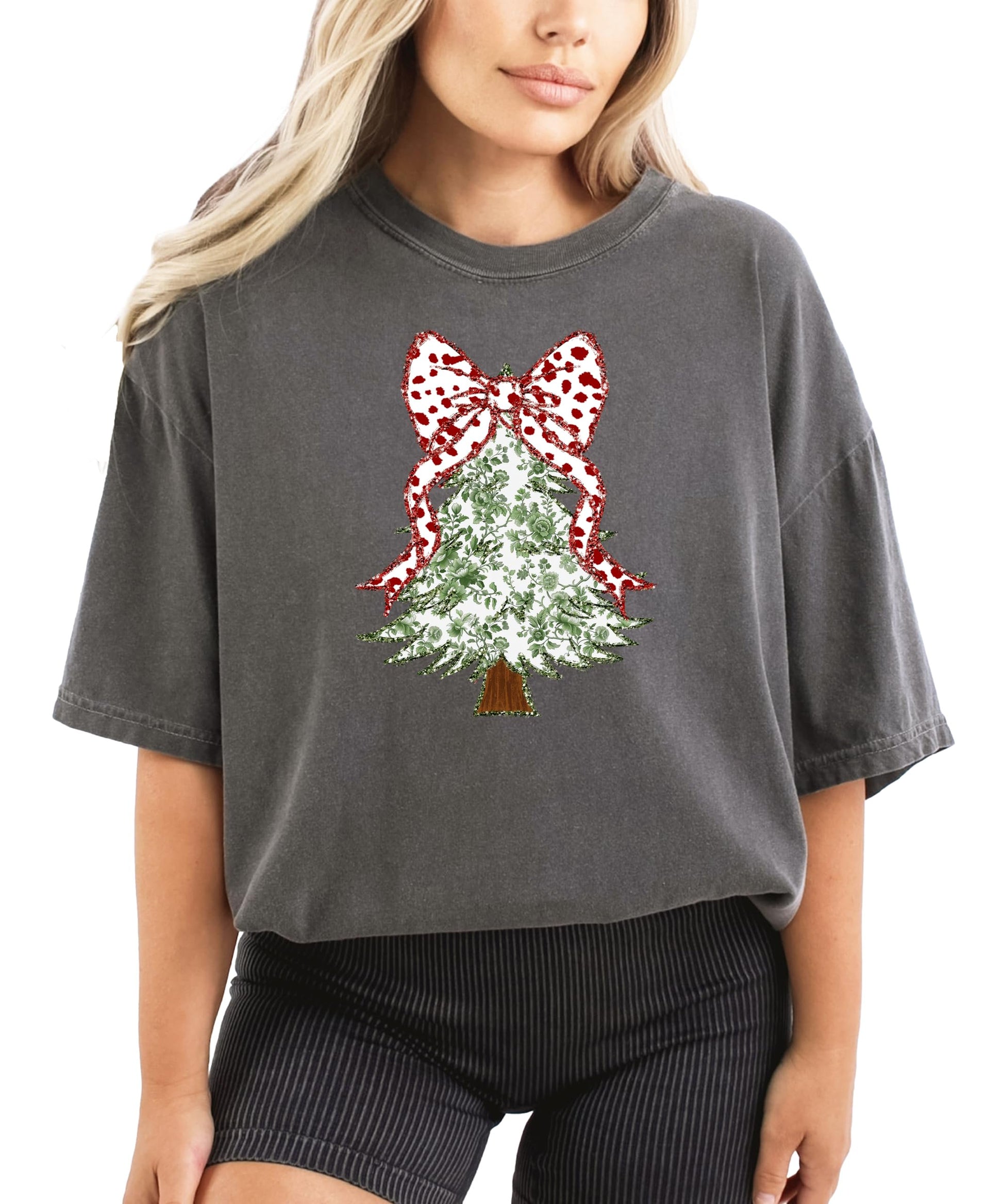 Side view of women's festive Christmas tee with floral glitter tree design in pepper colorway