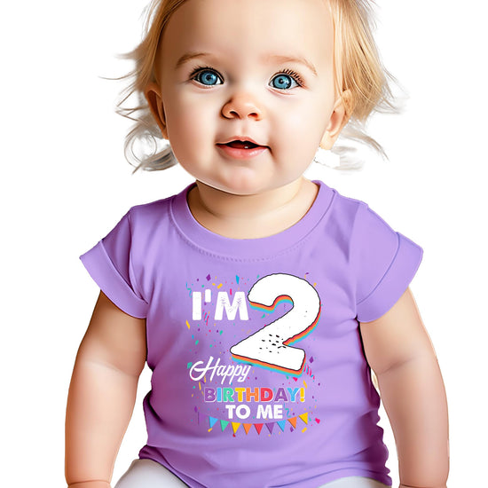 Close-up of 'I'm 2' birthday graphic print with colorful confetti details on a soft toddler tee