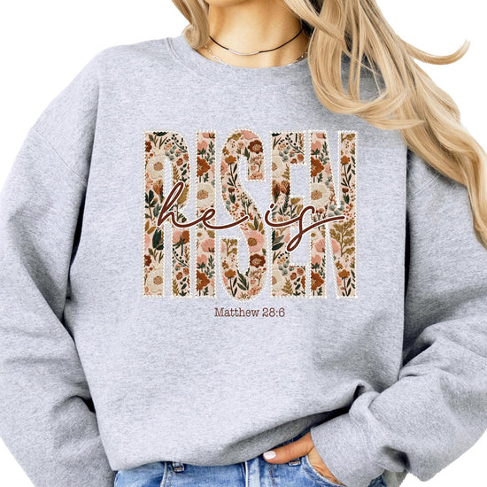 Close-up of ink-printed pearls and floral Easter design on women's faith sweatshirt