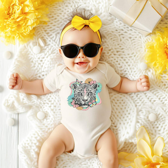 Girls retro leopard bodysuit with colorful floral print, shown laid flat on neutral background