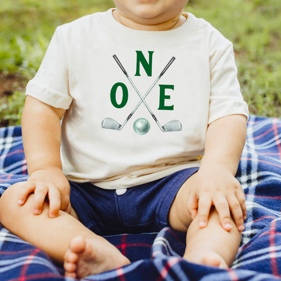 Toddler wearing Two Golf Sticks birthday shirt for golf themed party