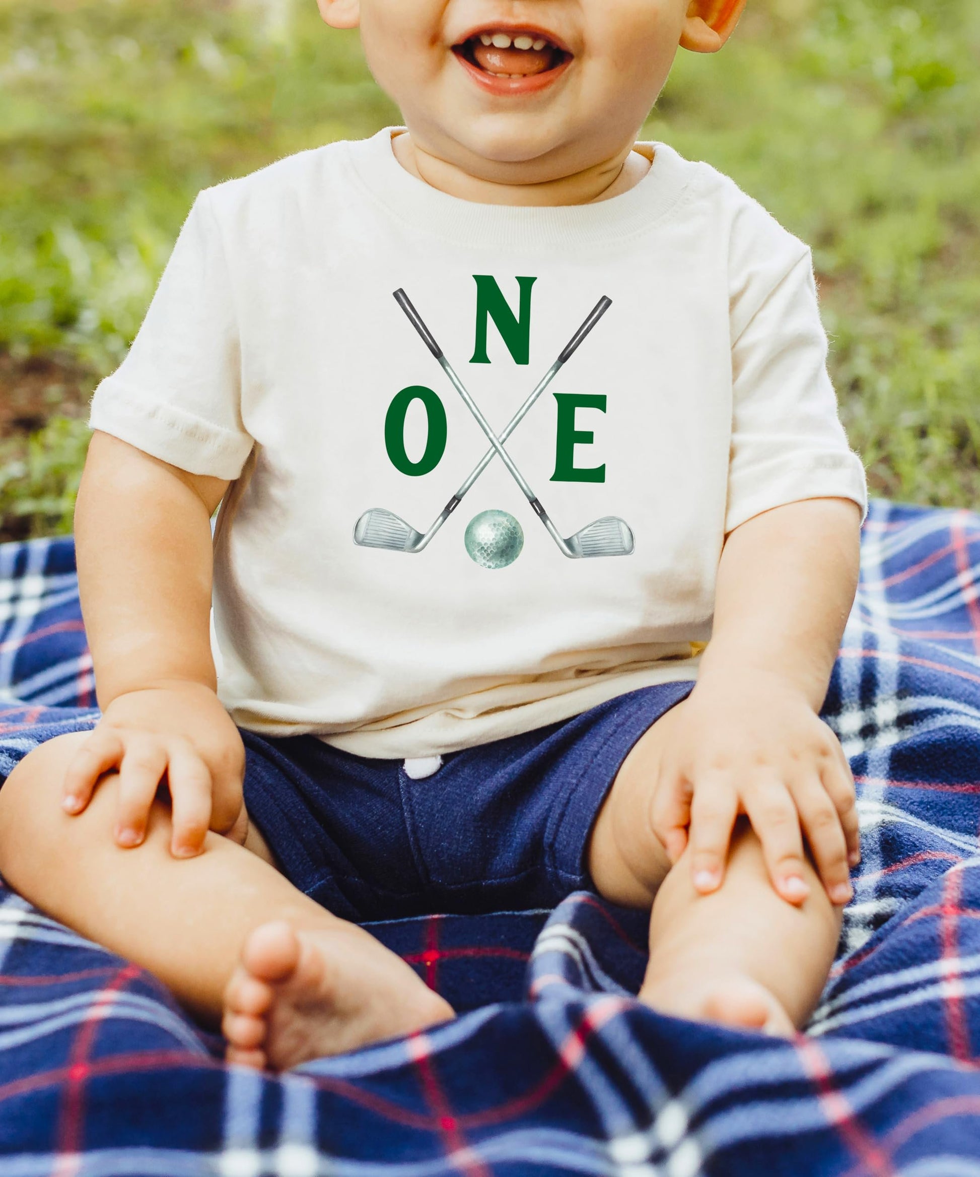 Toddler wearing Two Golf Sticks birthday shirt for golf themed party
