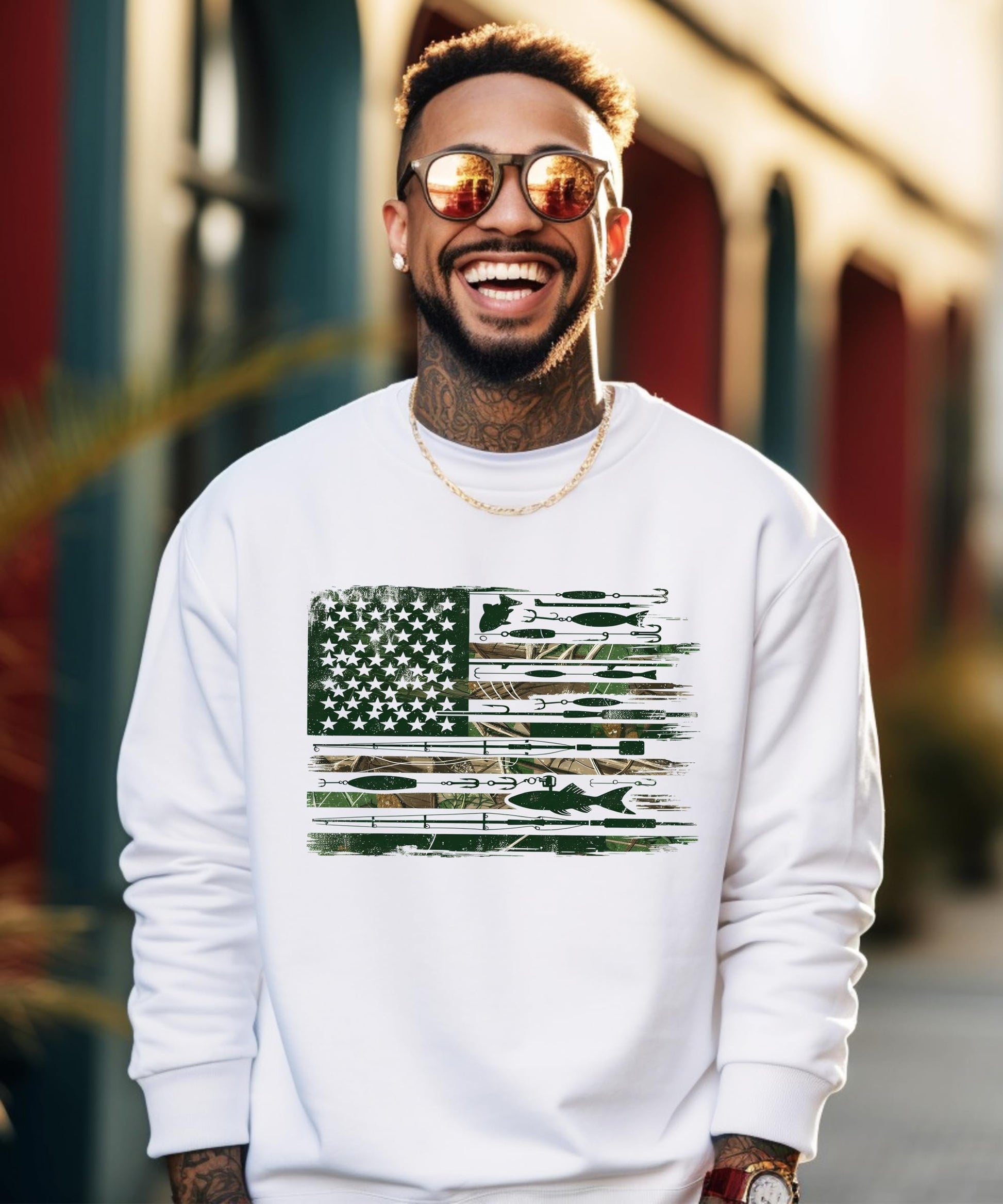 Close-up of fishing flag graphic on white sweatshirt featuring lures, hooks, and fishing rods forming an American flag