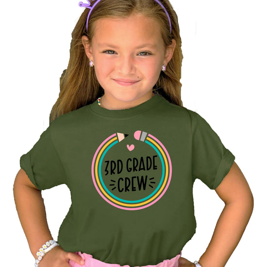 Close-up of vibrant pencil back to school graphic print on mauve kids tee