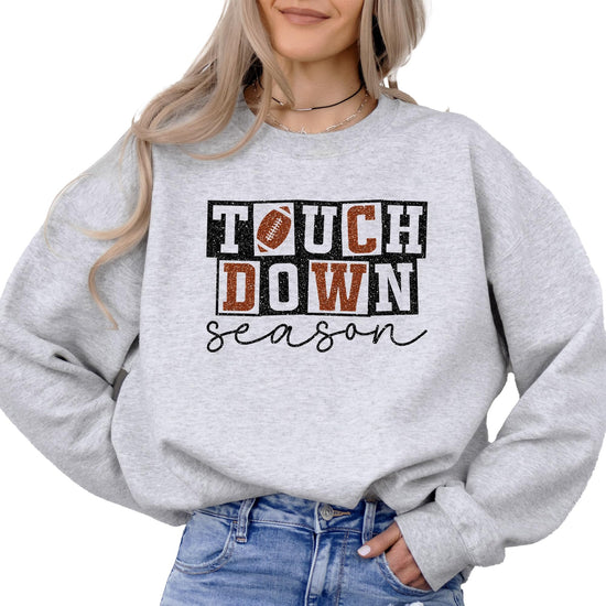 Girl wearing grey faux glitter football pullover sweatshirt front view