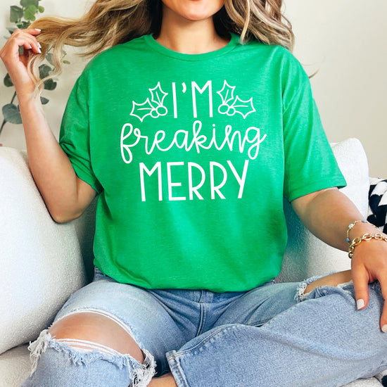 Model wearing sarcastic I'm Freaking Merry Christmas tee — perfect holiday party outfit