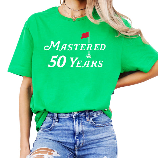 Unisex 50th birthday golf shirt laid flat showing full design graphic