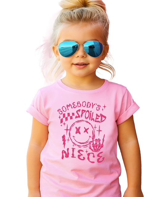 Young girl wearing pink Spoiled Niece shirt showing front design