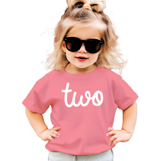 Toddler girls second birthday outfit featuring purple graphic tee with Two print, front view