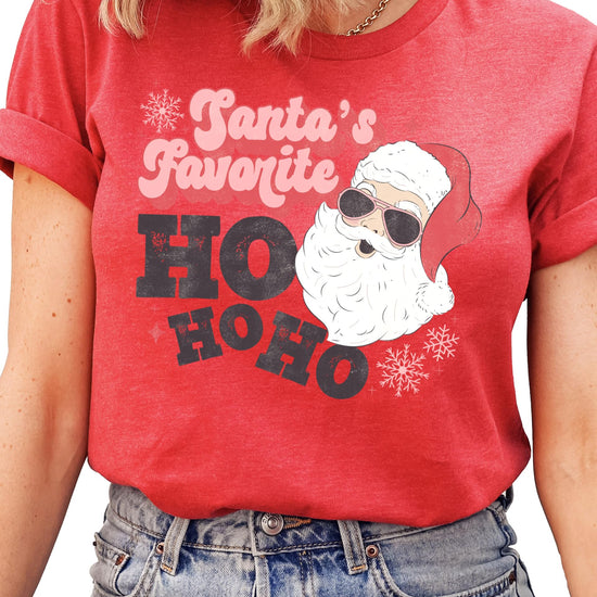 Women modeling Santa's Favorite Ho Ho Ho funny Christmas shirt in a relaxed casual holiday style