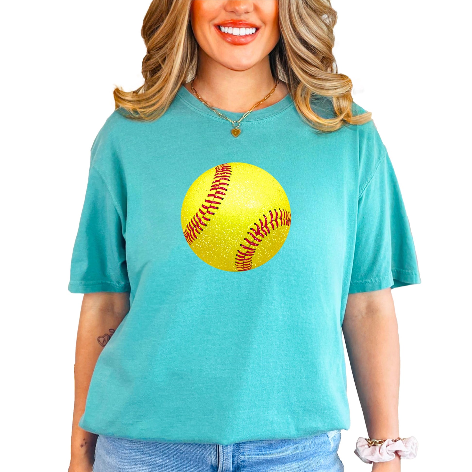 Detail shot of high-quality faux glitter softball print on soft ivory women's tee