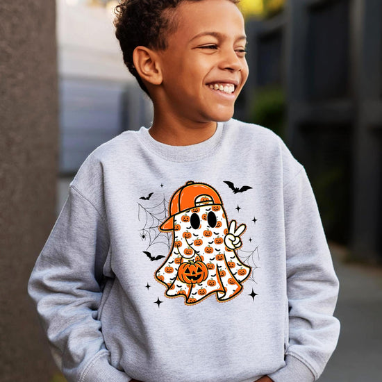 Youth Halloween graphic sweatshirt laid flat showing full ghost and bat pumpkin design on white pullover