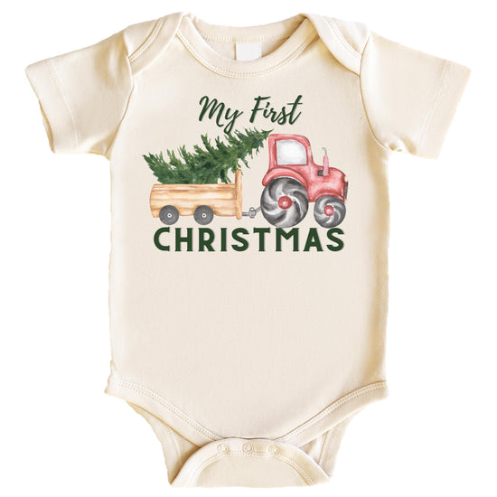 Natural-tone baby bodysuit with festive tractor and Christmas tree graphic for baby boy's first Christmas