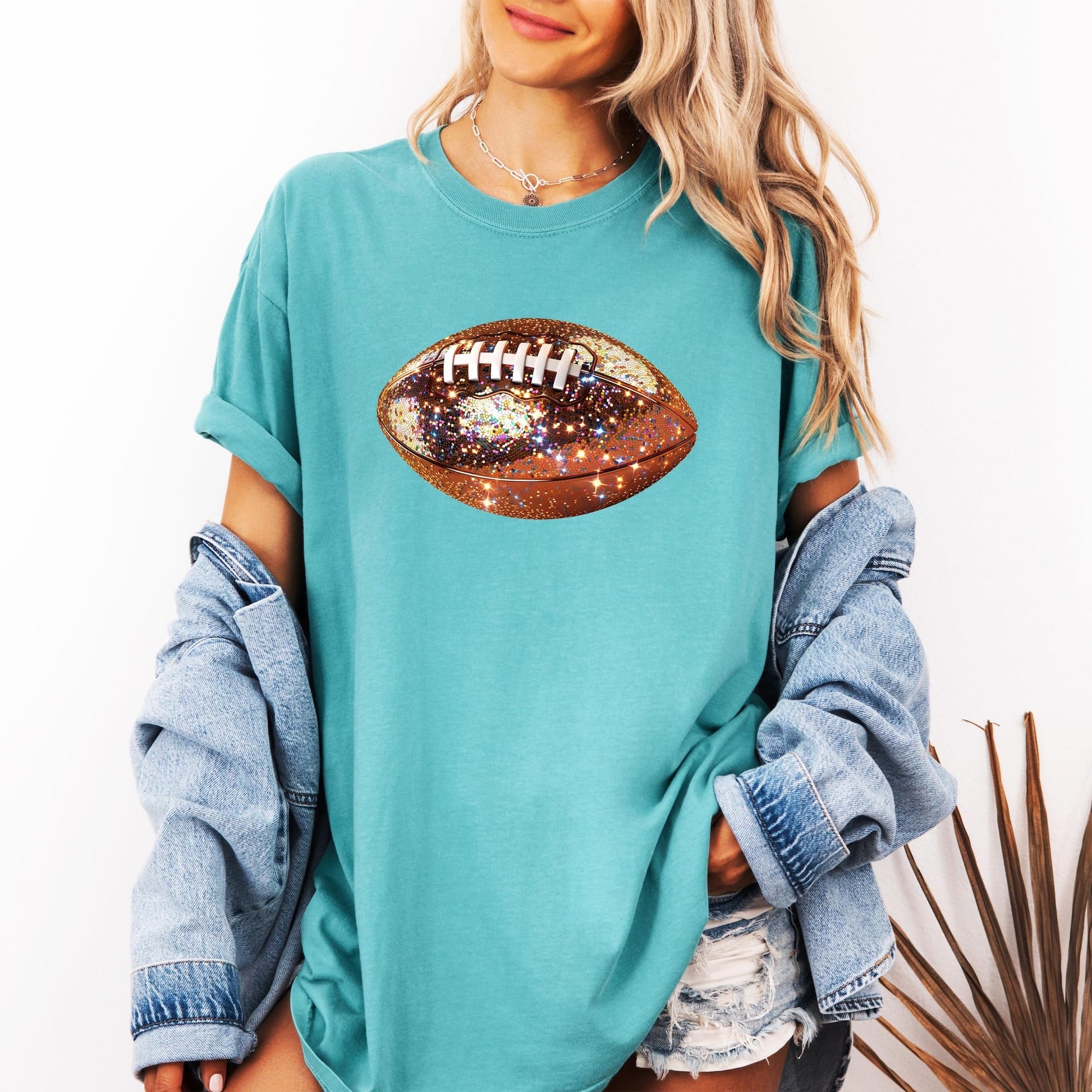 Detail shot of glitter print quality on women's football graphic shirt
