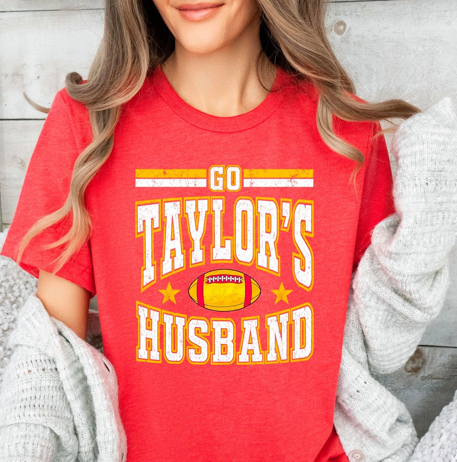 Close-up of Go Taylor's Husband lettering printed on vintage red cotton-poly blend game day shirt
