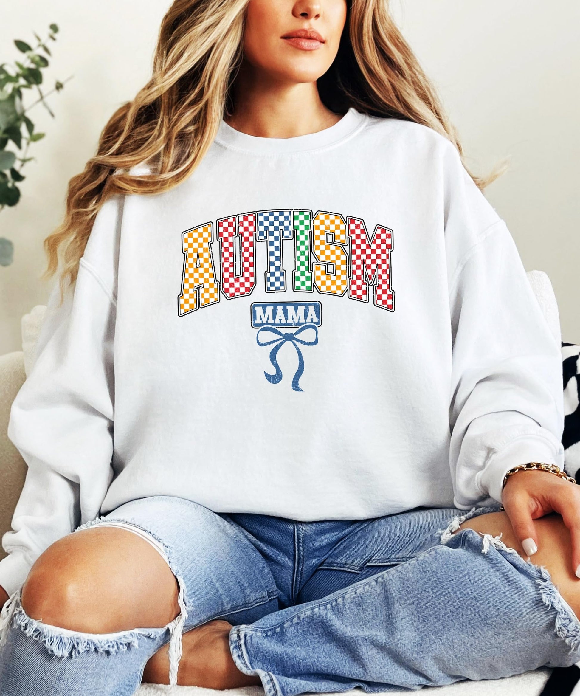 Side view of women's Autism Mama awareness pullover with multicolor graphic