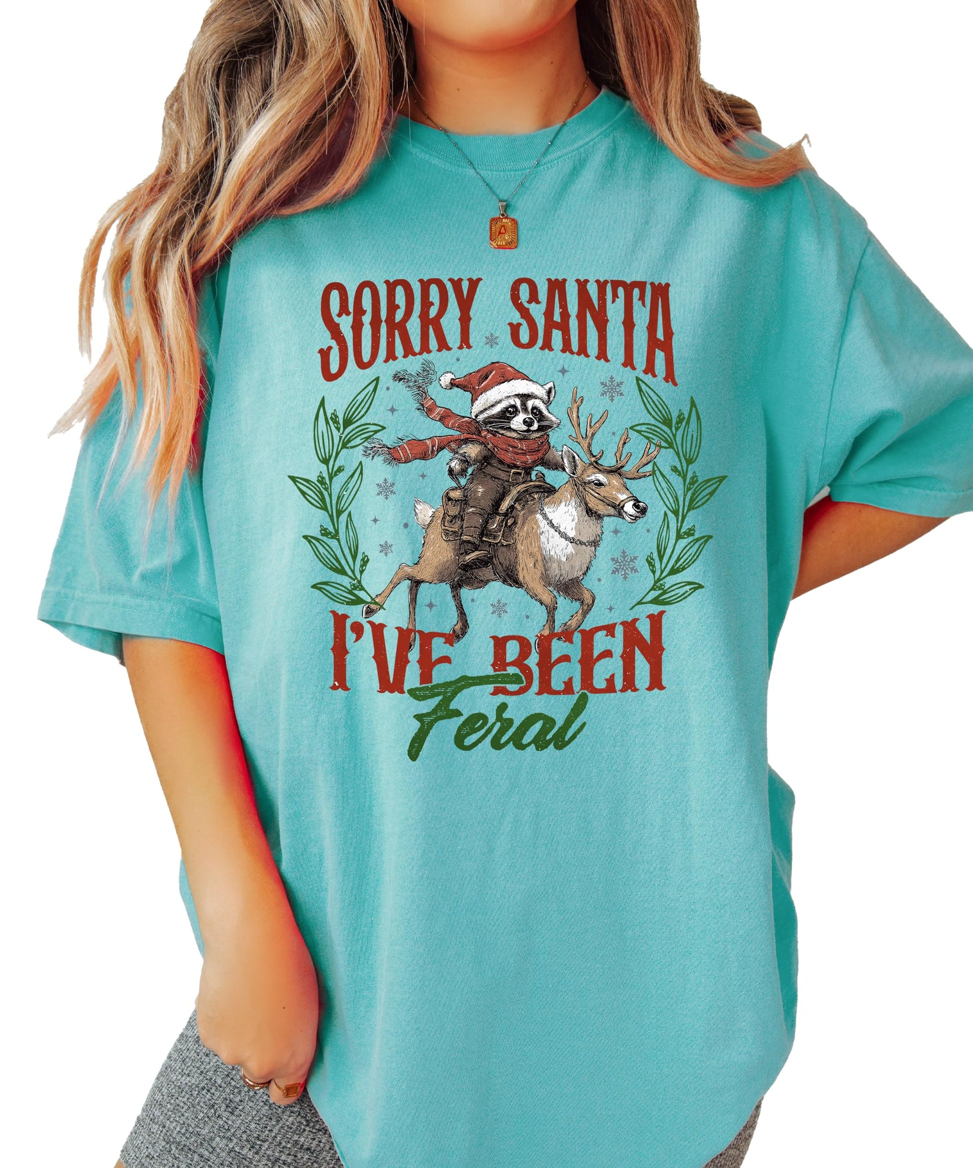 Sorry Santa I've Been Feral Christmas shirt laid flat showing full graphic design detail