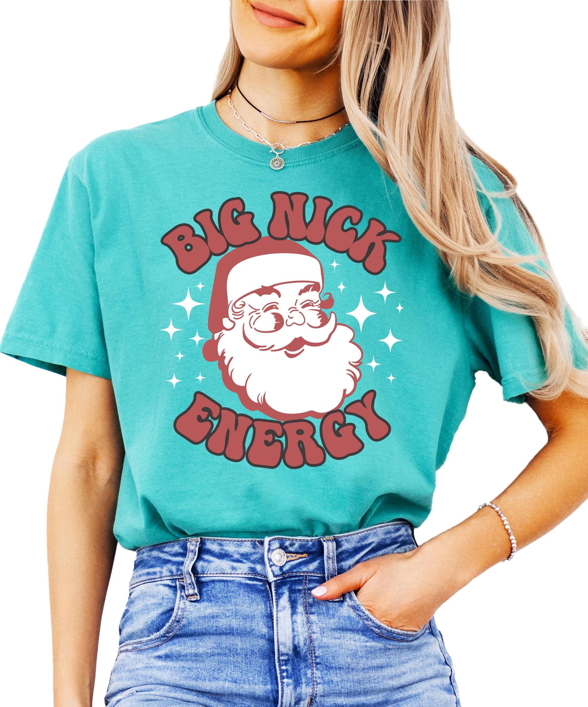 Close-up of Big Nick Energy jolly Santa graphic print on women's holiday tee