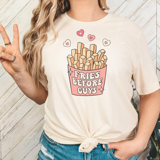 Close-up of Fries Before Guys graphic print detail on natural cotton tee