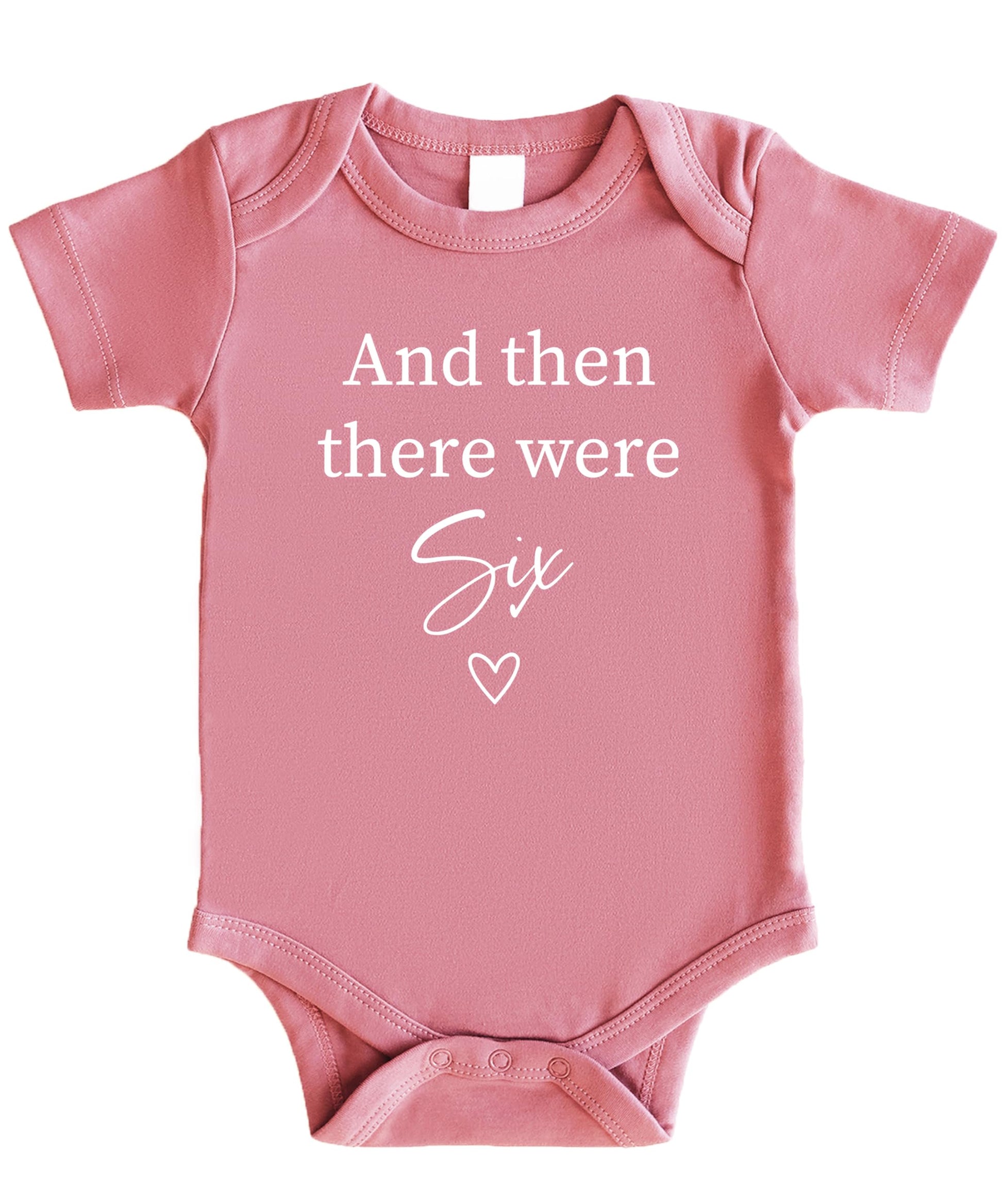 Mauve newborn bodysuit with 'And Then There Were 4' heart sibling announcement design by Olive Loves Apple