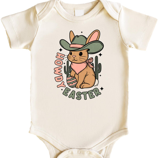 Front view of western Easter bunny one-piece bodysuit for baby girls in peach