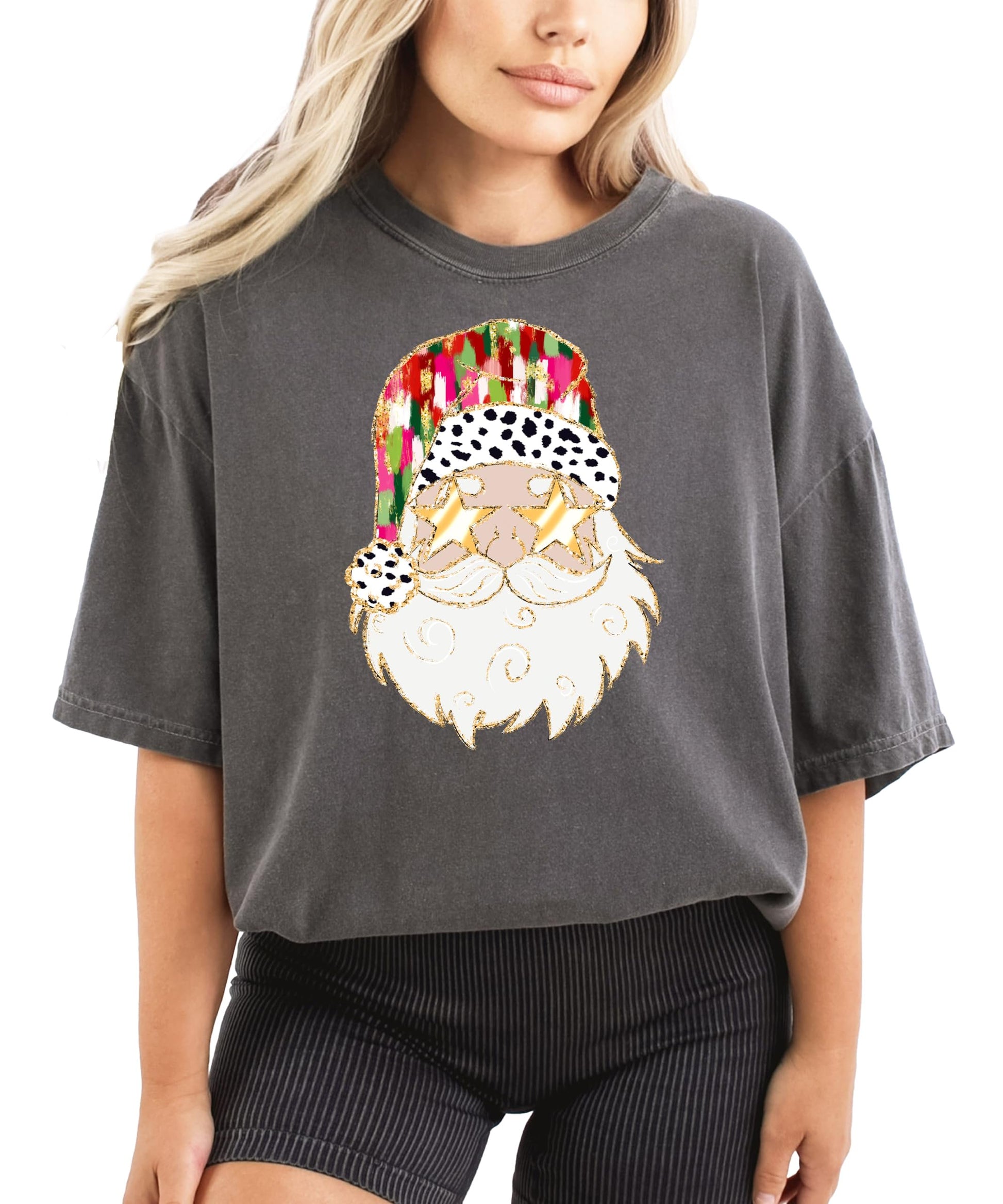 Flat lay of ivory women's Christmas shirt with funny painted Santa wearing gold sunglasses design