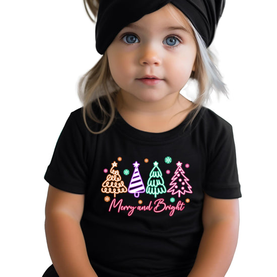 Women's black festive Christmas tee featuring colorful neon Merry and Bright graphic print