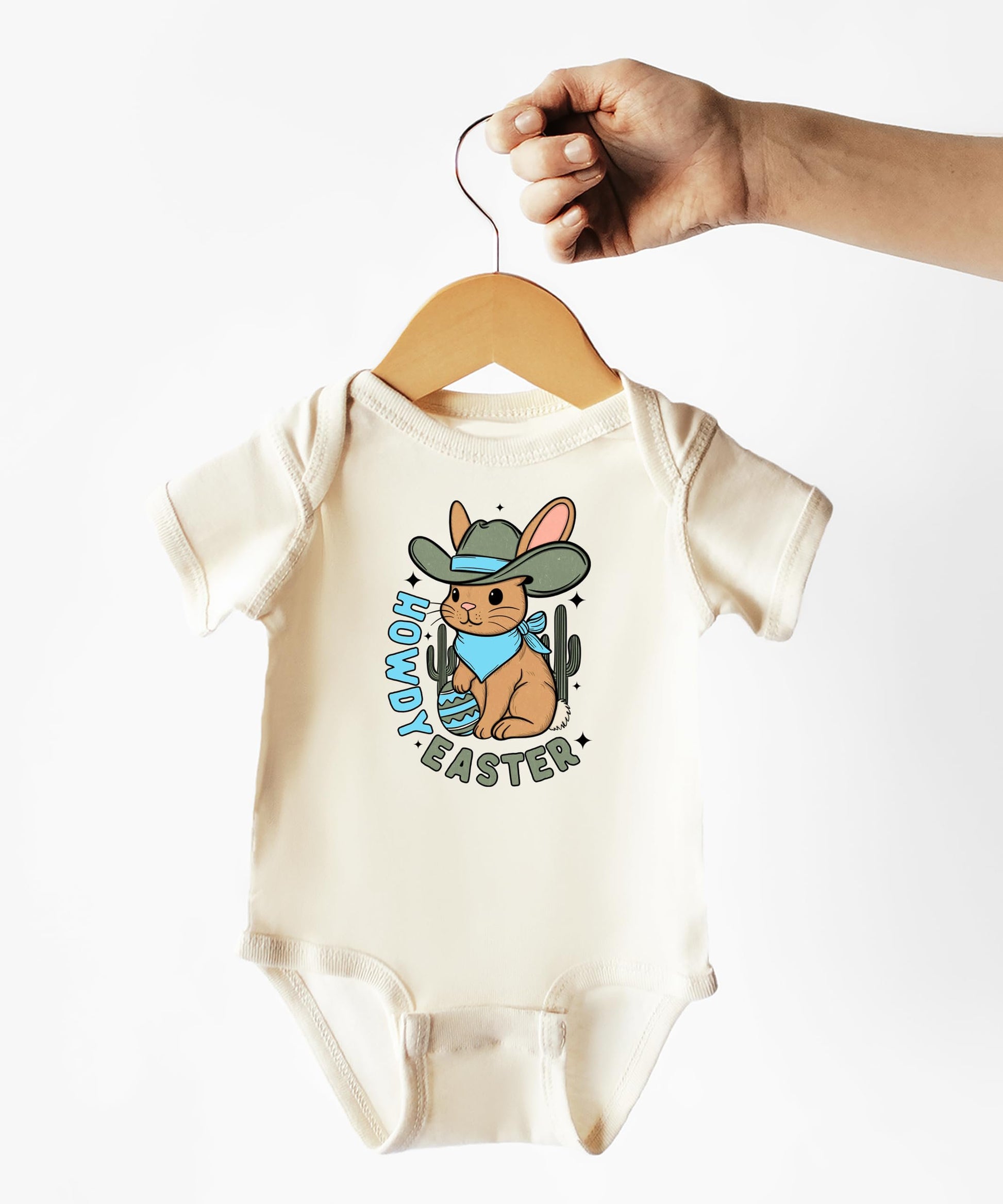 Baby bodysuit flat lay showing full Howdy Easter cowboy design