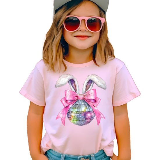 Flat lay of pink girls Easter shirt showing full disco bunny and sparkly bow graphic design