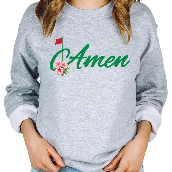 Close-up of Amen Golf graphic print on gray crewneck sweatshirt, vibrant and high-quality