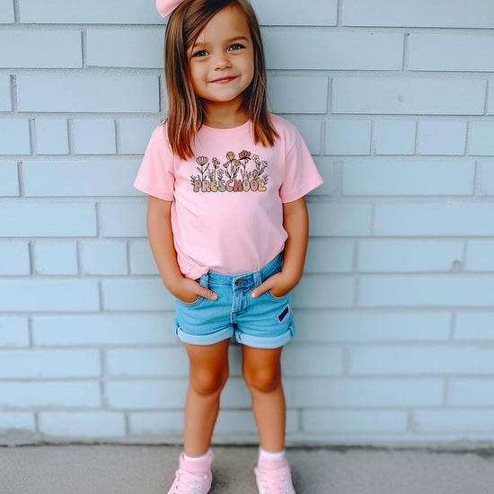 Side or back view of girls wildflower graphic tee in natural color