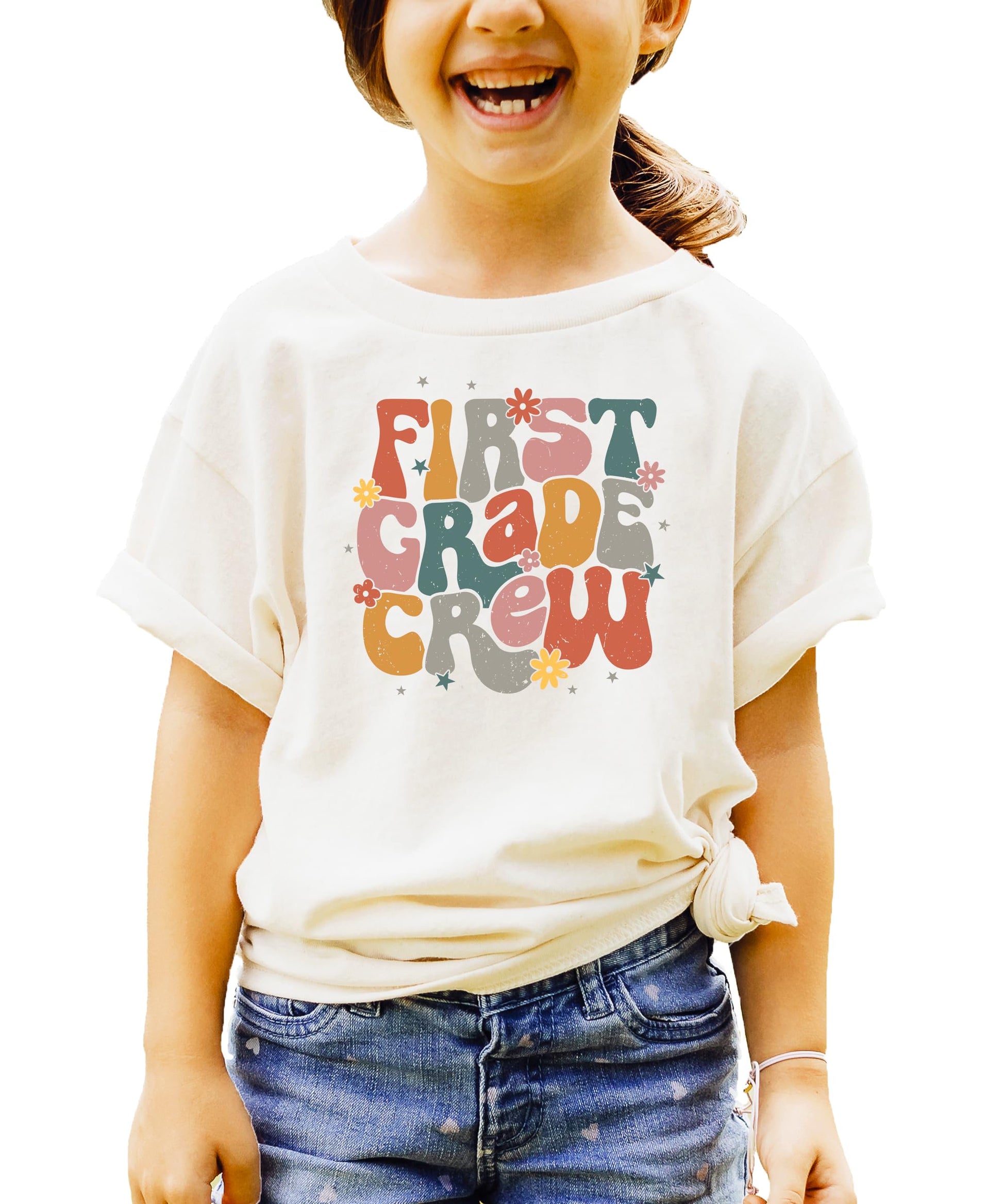Detail shot of vibrant multicolor First Grade Crew lettering on black shirt