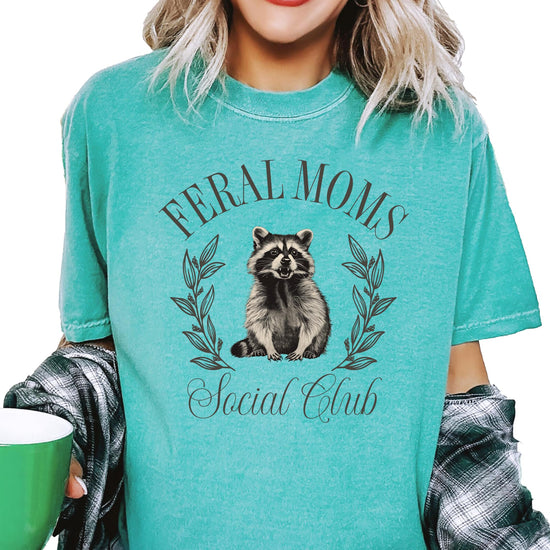 Detail shot of Feral Moms Social Club tee showing print quality and fabric texture