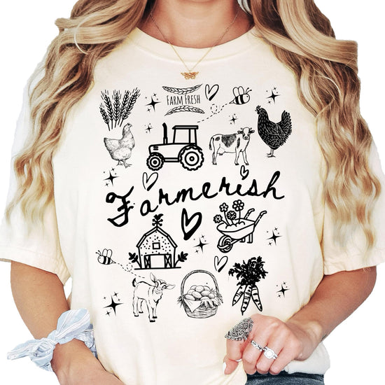 Farmerish women's graphic tee styled casually, featuring charming farm illustration design