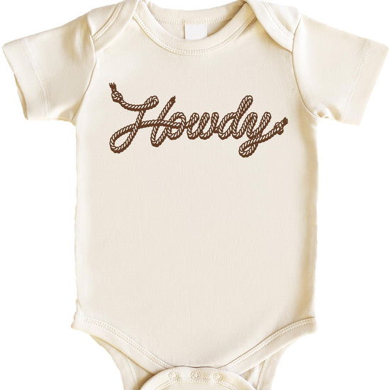 Flat lay of peach Howdy baby bodysuit with country western rope lettering design