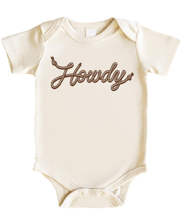 Flat lay of peach Howdy baby bodysuit with country western rope lettering design