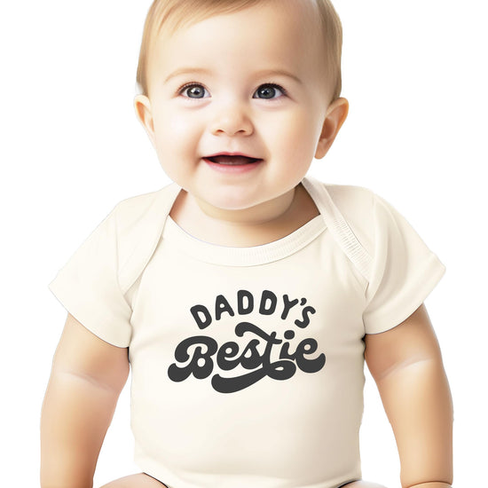 Peach baby bodysuit with retro Daddy's Bestie graphic print, unisex onesie for boys and girls