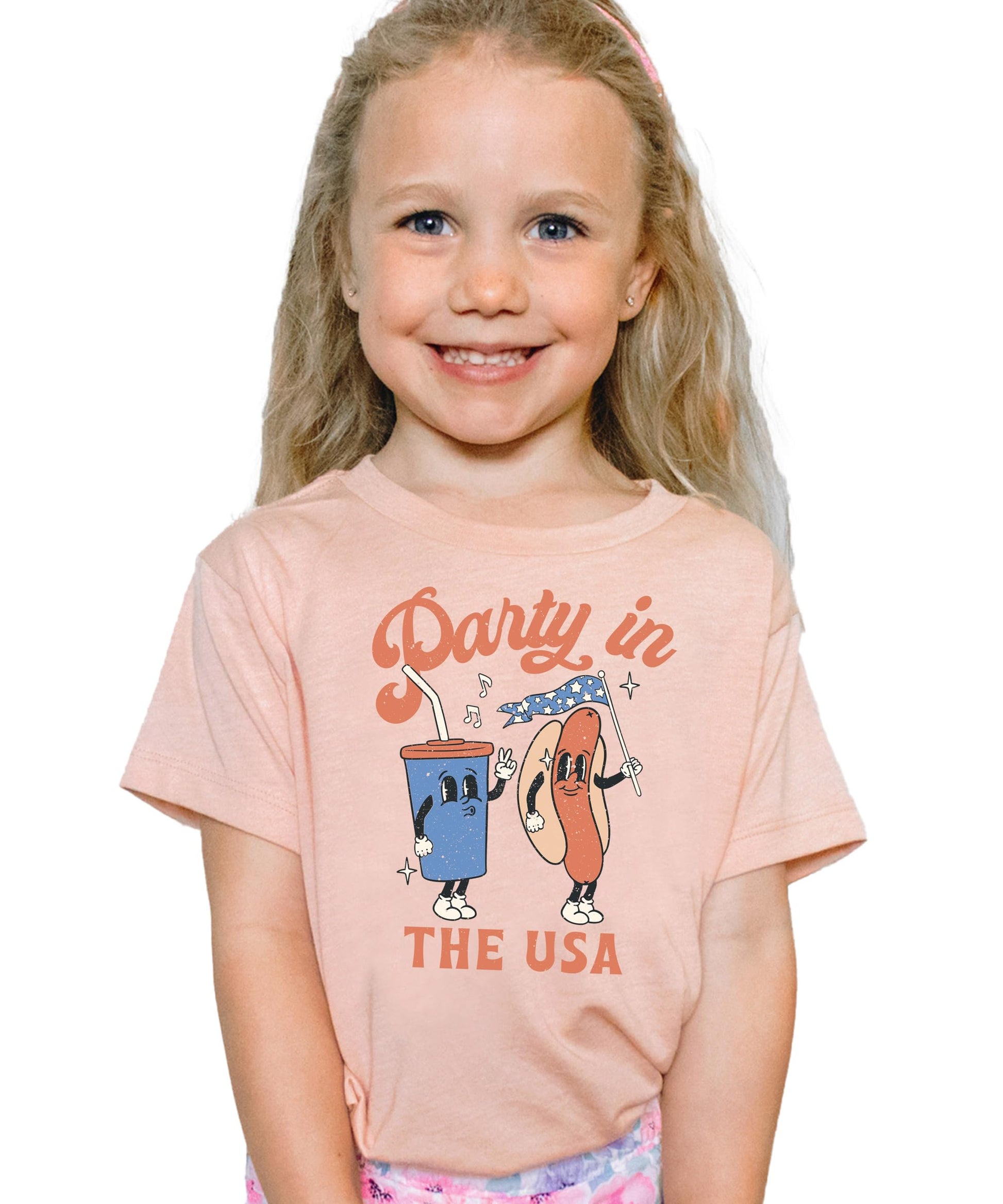 Person wearing pink 4th of July hotdog shirt with patriotic design