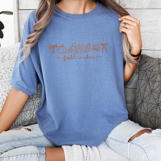 Fall Vibes women's tee flat lay showing ivory color and seasonal graphic design