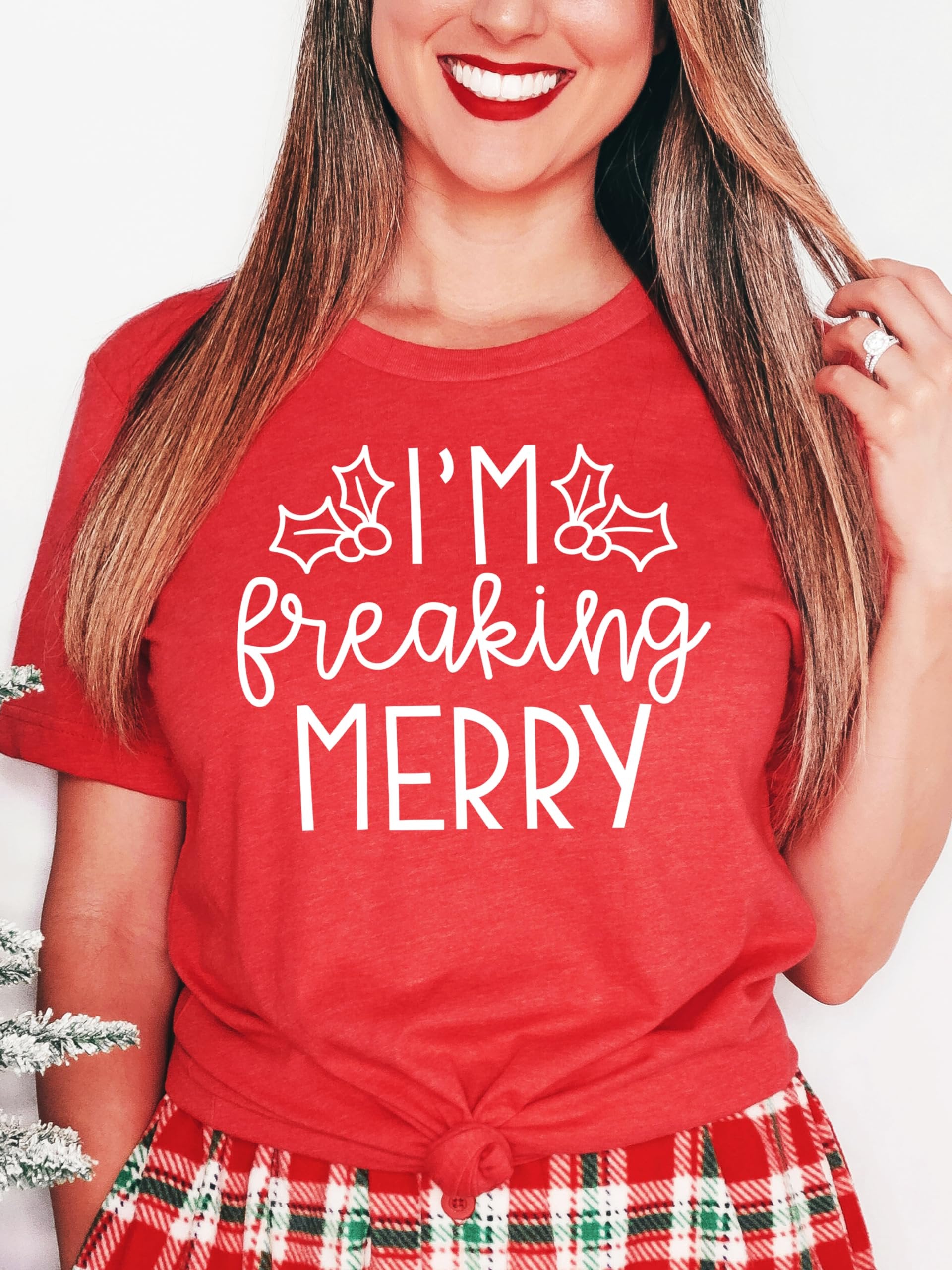 Close-up of I'm Freaking Merry holiday graphic print on soft green women's Christmas shirt