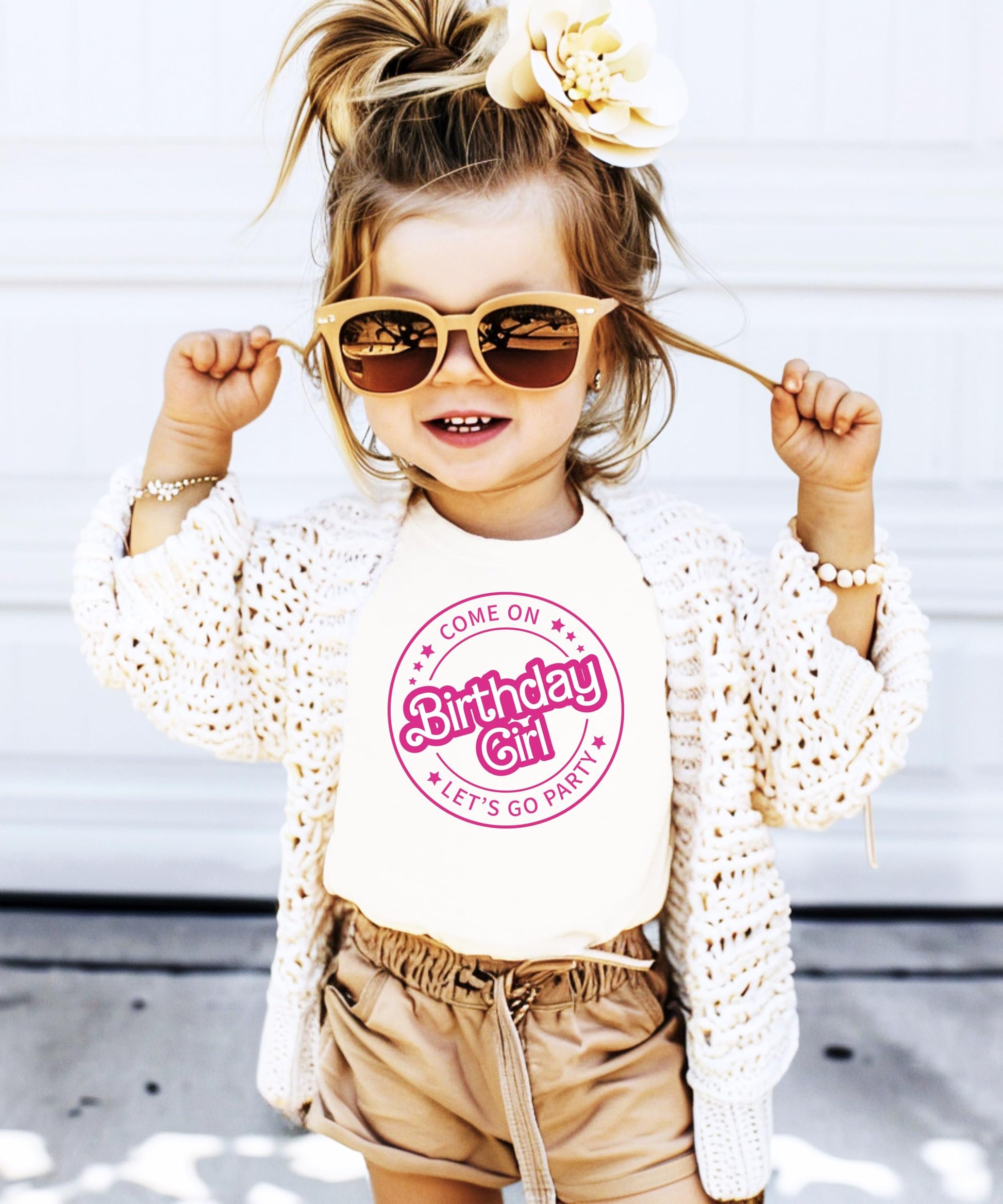 Close-up of Come On Let's Go Party birthday girl shirt showing vibrant retro pink graphic print