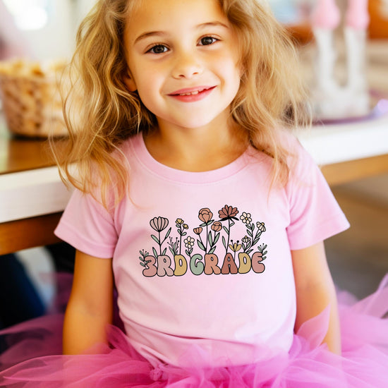 Military green youth girls 3rd grade floral tee displayed folded, showing print detail