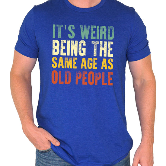 Close-up of bold graphic print on funny men's dark gray t-shirt about getting older