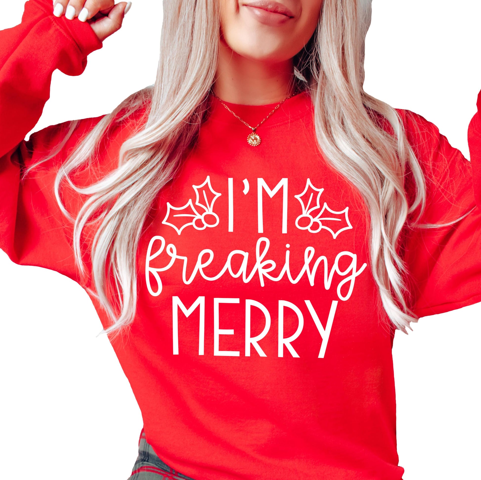 Women's red Christmas sweatshirt with 'I'm Freaking Merry' sarcastic holiday graphic print