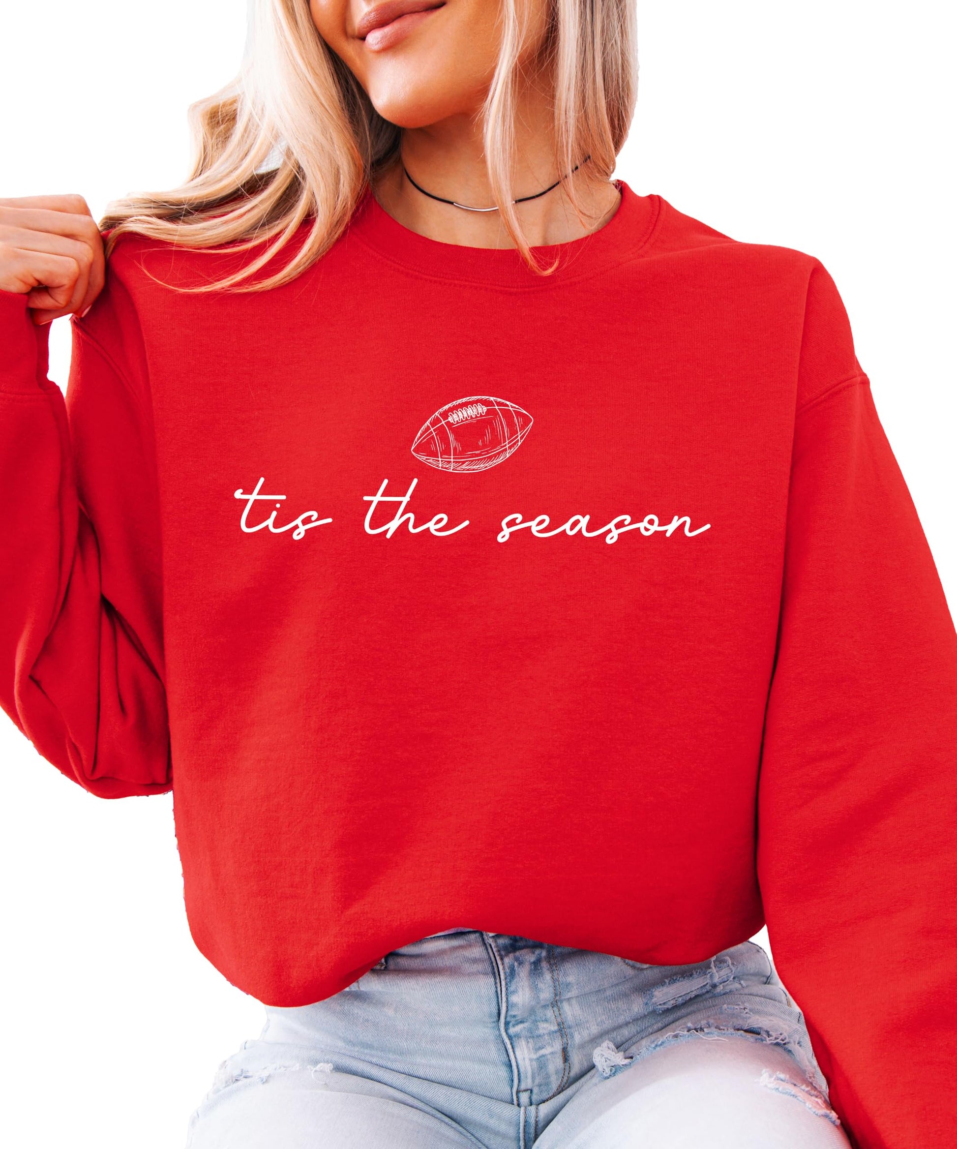 Flat lay of Olive Loves Apple 'Tis the Season football sweatshirt showing full print detail
