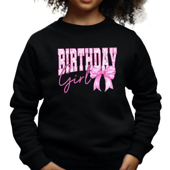 Birthday Girl sweatshirt laid flat showing full front graphic with pink bow and glitter-style print