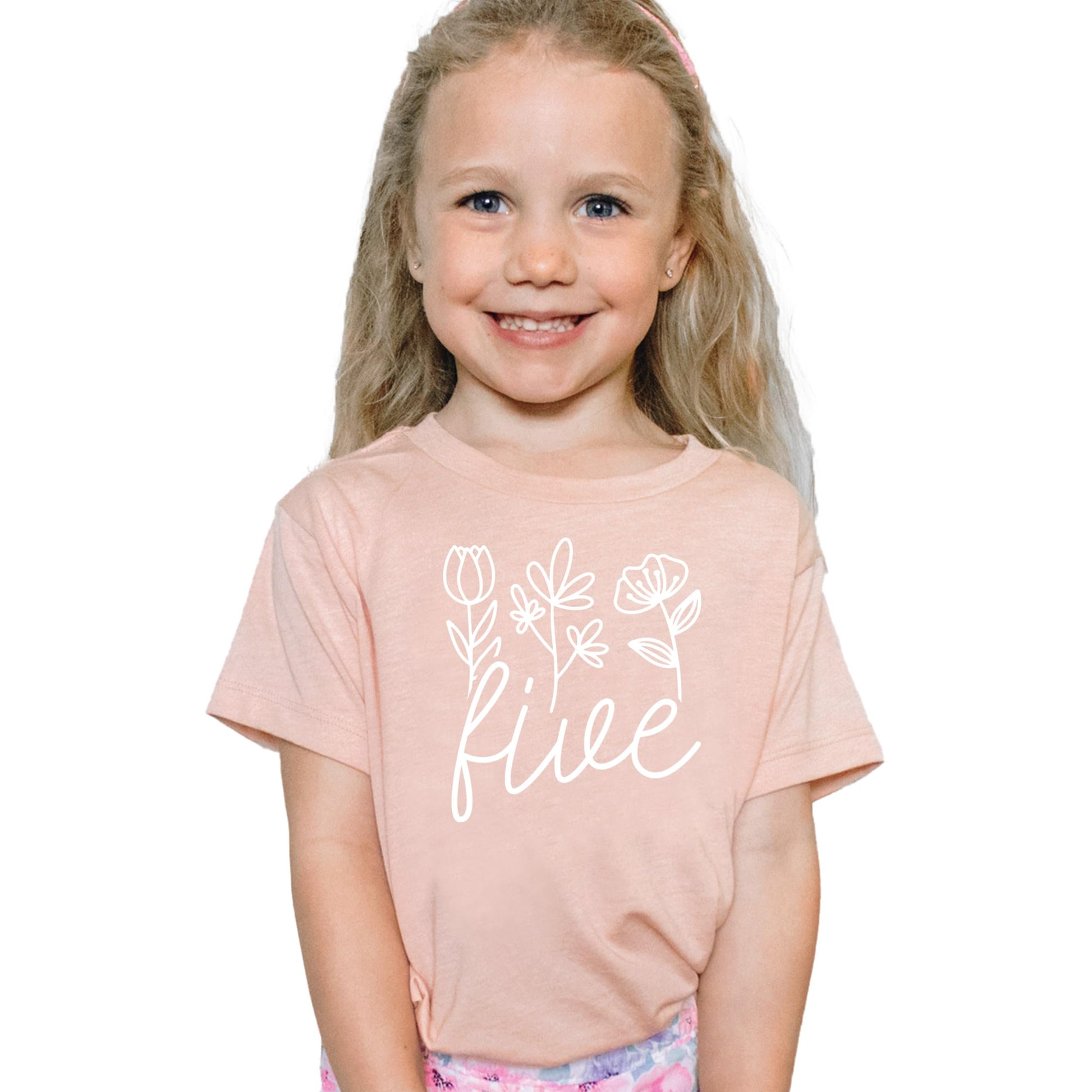 Detail shot of professional white floral print on military green girls birthday tee
