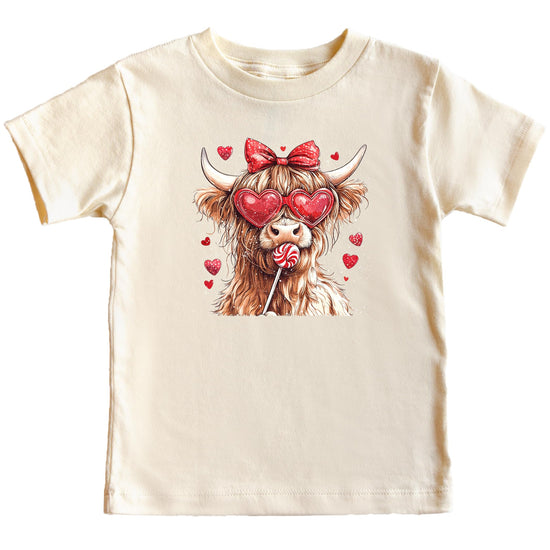 Kids' pink Highland cow Valentine's Day shirt with hearts and candy graphic print