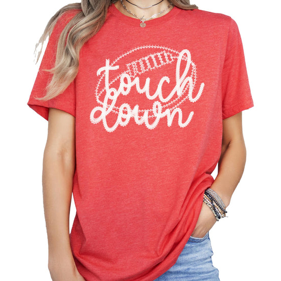 Woman wearing black touchdown football graphic tee showing fit and style